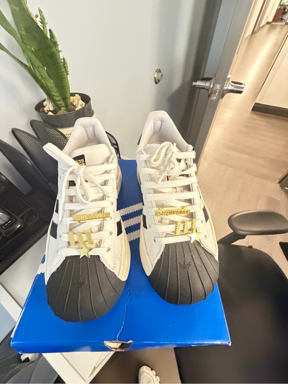 adidas Super Star BoldWomen’s White & Black Superstar Sneakers with Gold Accents